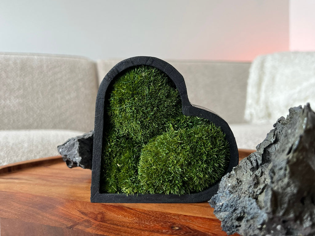 Side view of heart moss art showing wooden frame depth and moss detail