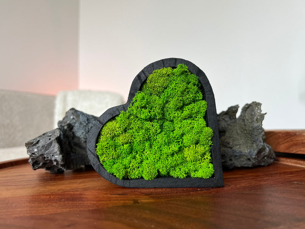Side view of heart moss art showing wooden frame depth and moss detail